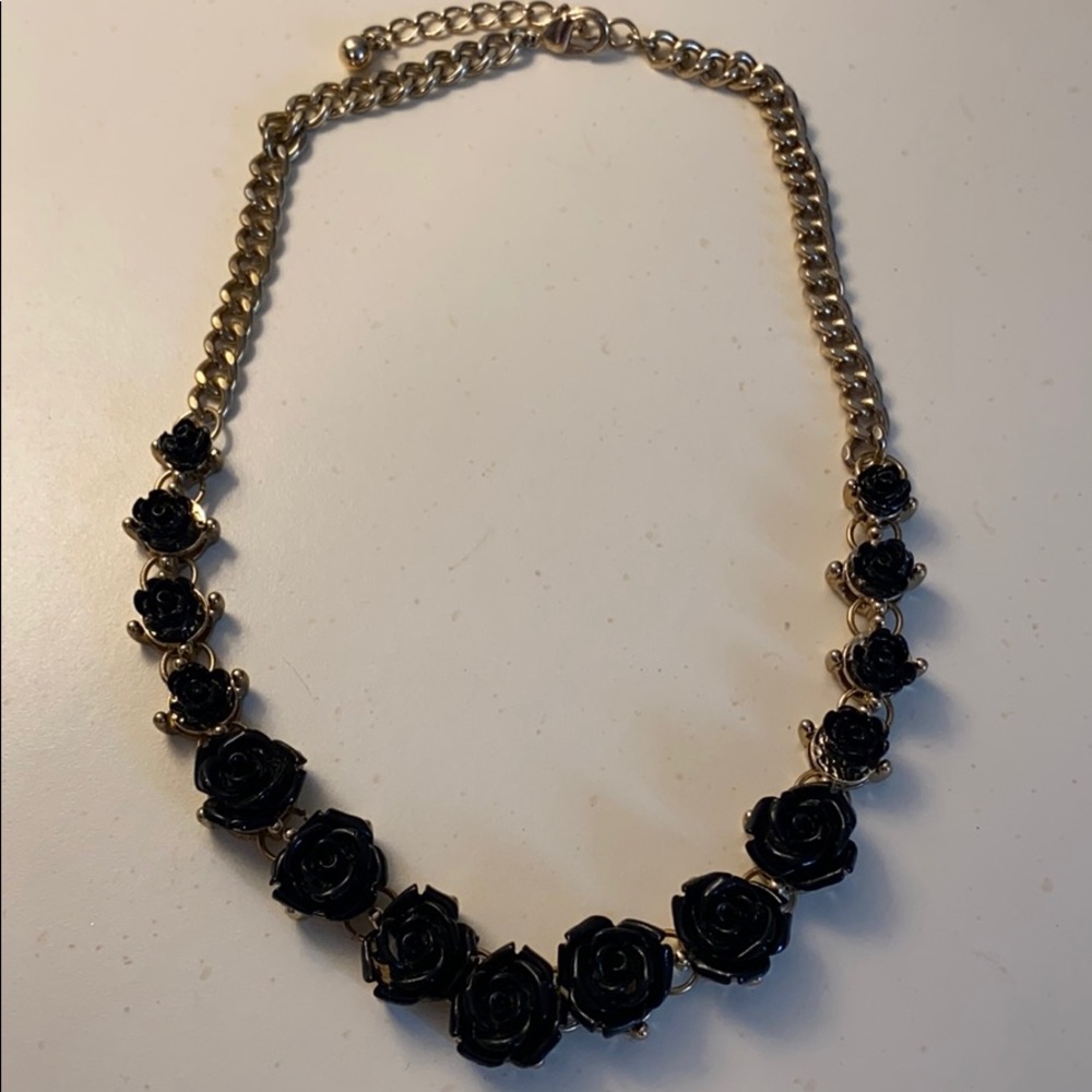 Black rose necklace with a gold chain